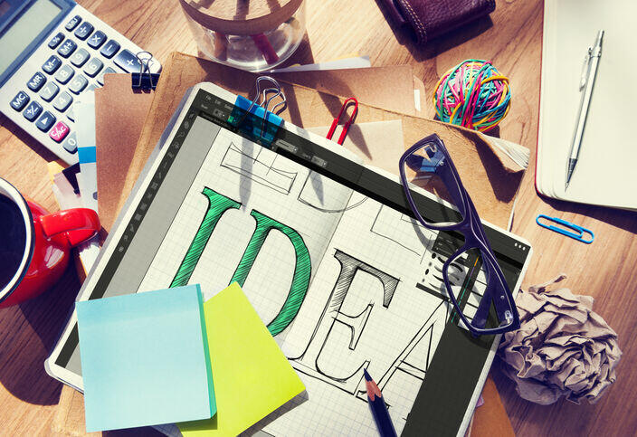 Creative logo design concepts sketched during the branding and design process
