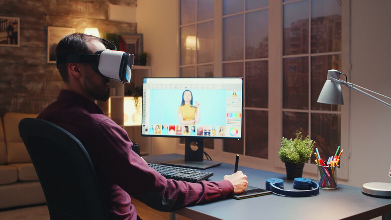 Designer using AI and virtual reality tools for creative logo design and branding